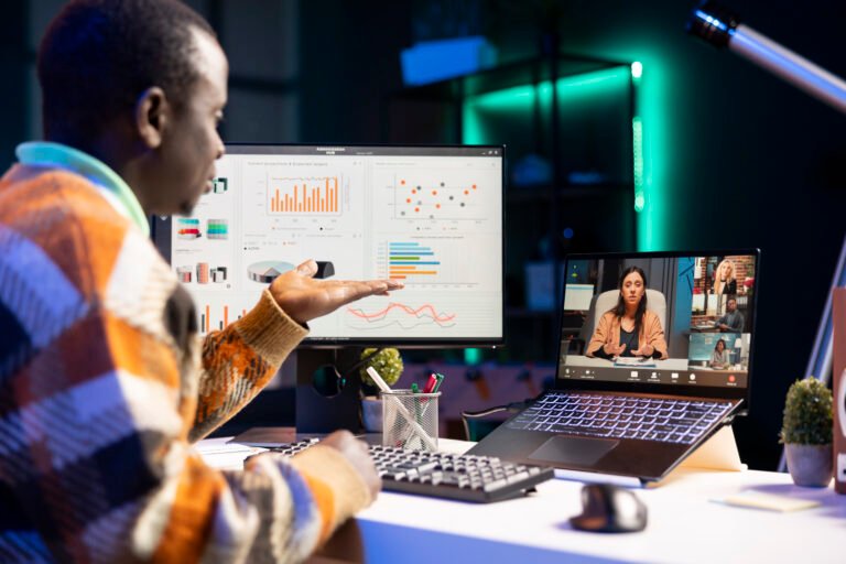 young adult employee attends a meeting on video conference